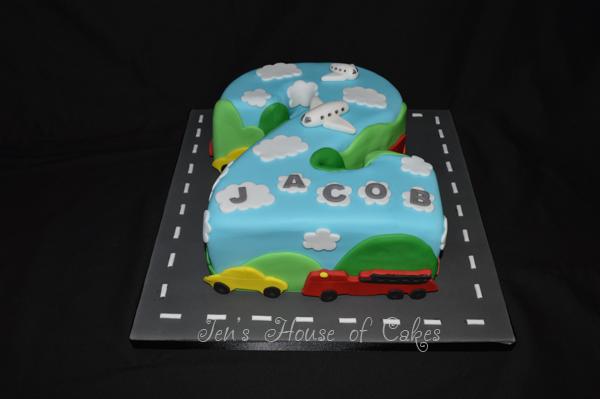 Number 2 shaped transport themed cake